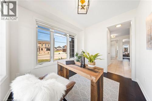 Office space with dark wood-style flooring and baseboards - 1 Bee Crescent, Brantford, ON 