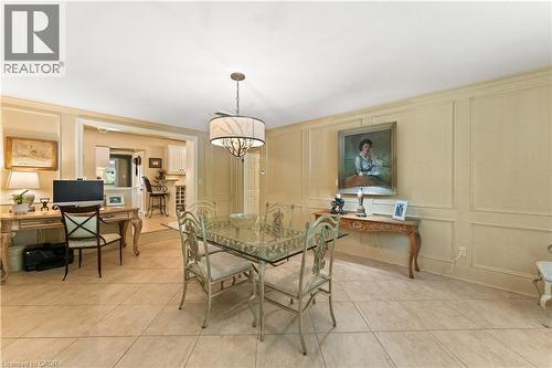 Currently used as an informal dining area and office. Heated flooring. High end fixture. Plantation shutters. Adjoins kitchen and mudroom. - 3040 First Street, Burlington, ON - Indoor Photo Showing Dining Room