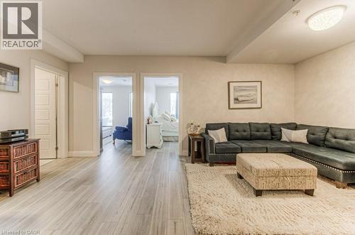 Spacious living area featuring light wood-finish flooring - 5 Wake Robin Drive Unit# 107, Kitchener, ON 