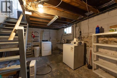 Basement featuring sink and washing machine and clothes dryer - 501 Upper Wellington Street, Hamilton, ON 