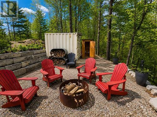 Firepit, Seacan Bar, and Outhouse with Running wtr - 1045 Carnahan Lane, Frontenac (Frontenac Centre), ON 