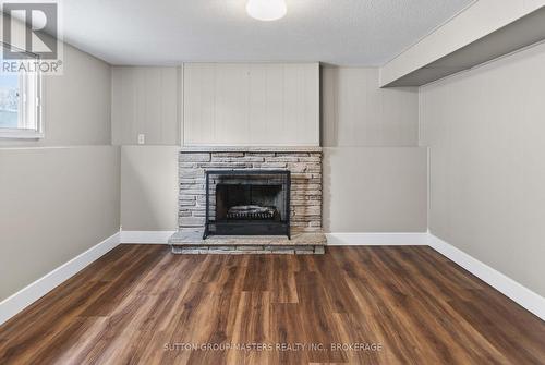 ...and a cozy fireplace! - 932 Brodie Avenue, Kingston (City Southwest), ON - Indoor Photo Showing Living Room With Fireplace