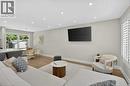 Open-concept living area with light wood-finish flooring, recessed lighting, and crisp white trim - 603 Cornick Drive, Burlington, ON 