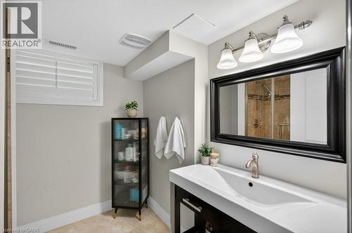 Contemporary vanity with an integrated sink and brushed nickel faucet - 603 Cornick Drive, Burlington, ON 