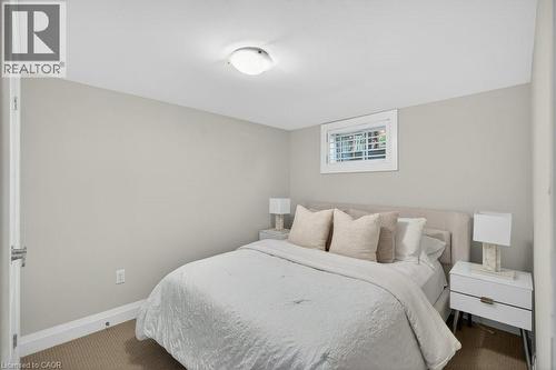 Neutral-toned room featuring a single window with blinds, light gray walls, and recessed lighting - 603 Cornick Drive, Burlington, ON 