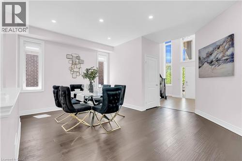 Formal dining area with recessed lighting, dark wood-finish flooring, and light-toned walls - 92 Desoto Drive, Hamilton, ON - Indoor