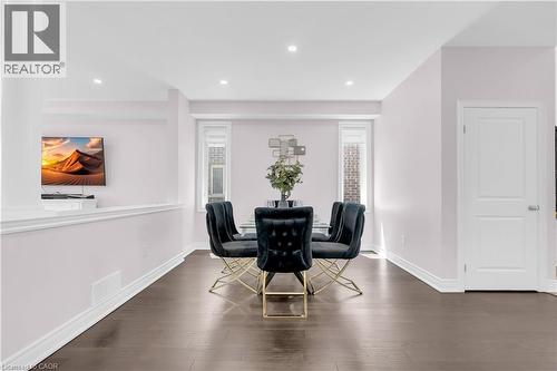 Dining area featuring dark wood-finish flooring, recessed lighting, and pale lavender walls - 92 Desoto Drive, Hamilton, ON - Indoor