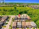 Aerial perspective of a residential street with detached homes featuring varied architectural styles and pitched roofs - 92 Desoto Drive, Hamilton, ON  - Outdoor With View 