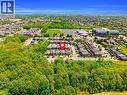 Aerial perspective showcasing a residential development bordered by extensive green spaces - 92 Desoto Drive, Hamilton, ON  - Outdoor With View 