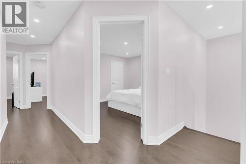 Hallway featuring wood-finish flooring, recessed lighting, white baseboards, and light-toned walls - 92 Desoto Drive, Hamilton, ON - Indoor Photo Showing Other Room