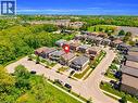 Aerial perspective showcasing a residential street with detached and semi-detached homes - 92 Desoto Drive, Hamilton, ON  - Outdoor With View 