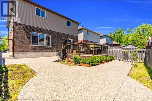 Rear exterior featuring a multi-level deck, brick and siding facade, and a privacy fence - 92 Desoto Drive, Hamilton, ON - Outdoor