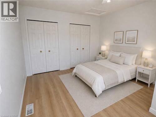 Bedroom featuring light wood-finish flooring and a neutral color palette - 390 Wake Robin Crescent, Kitchener, ON - Indoor Photo Showing Bedroom
