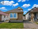 Exterior featuring a brick facade with light-toned siding, a bay window, and a shingled roof - 390 Wake Robin Crescent, Kitchener, ON  - Outdoor 