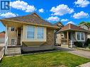 The property features a brick and siding exterior with a multi-toned shingle roof - 390 Wake Robin Crescent, Kitchener, ON  - Outdoor With Facade 