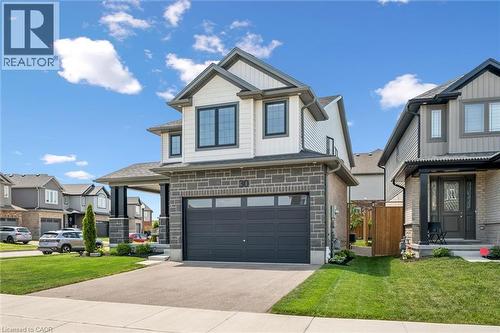 Contemporary two-story residence featuring a stone and siding exterior - 30 Waterbow Trail, Kitchener, ON - Outdoor With Facade