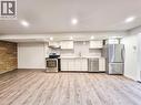 Kitchenette featuring stainless steel appliances, light-toned cabinetry, and a subway tile backsplash - 11 Duncairn Avenue, Kitchener, ON 