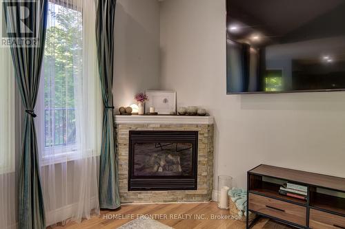 42 Forest Circle, Tiny, ON - Indoor Photo Showing Living Room With Fireplace
