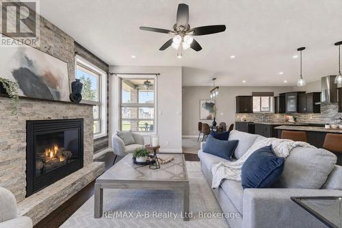 70 Kenton Street, West Perth (Mitchell), ON - Indoor Photo Showing Living Room With Fireplace