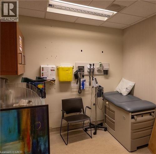 Examination room with a drop ceiling and integrated fluorescent lighting - 365 Colborne Street, Brantford, ON 