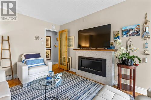 107 - 2625 Regina Street, Ottawa, ON - Indoor Photo Showing Living Room With Fireplace