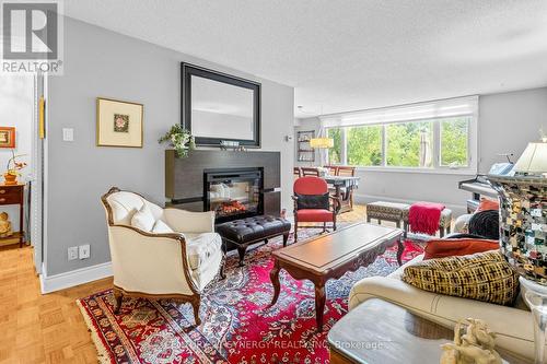 107 - 2625 Regina Street, Ottawa, ON - Indoor Photo Showing Living Room With Fireplace