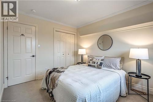 Wall-to-wall carpeting and crown molding frame this room - 640 Acadia Drive, Hamilton, ON 