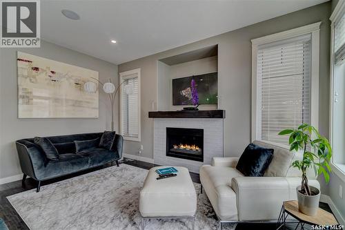 4606 Curtiss Avenue, Regina, SK - Indoor Photo Showing Living Room With Fireplace