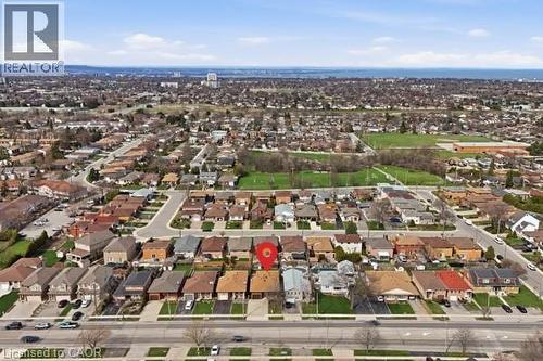 Aerial perspective showcasing a residential neighborhood with varied housing styles - 957 Stone Church Road E, Hamilton, ON - Outdoor With View