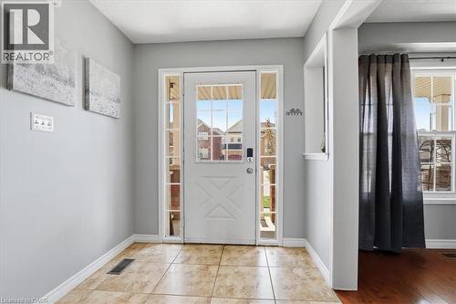 Entryway featuring a white door with glass lites, sidelight windows, and tile flooring - 136 Carpenter Road, Cambridge, ON - Indoor Photo Showing Dining Room