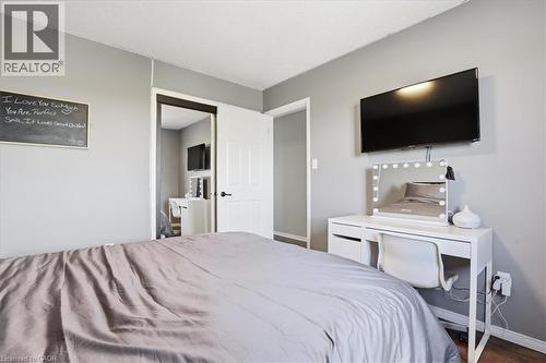 Gray painted walls, white trim, and a white popcorn ceiling - 136 Carpenter Road, Cambridge, ON - Indoor Photo Showing Bedroom