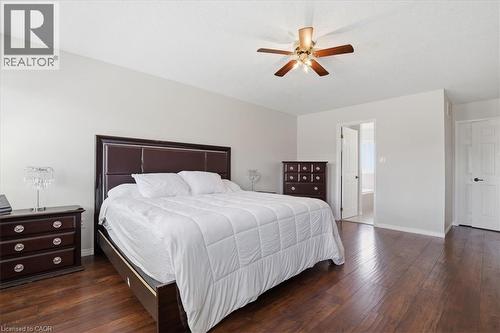 Spacious room featuring wood-finish flooring, a ceiling fan, and light-colored walls - 136 Carpenter Road, Cambridge, ON - Indoor Photo Showing Bedroom
