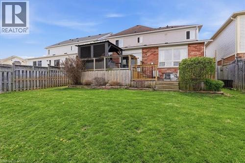 Expansive lawn area featuring a multi-level wood deck with a dark-tone gazebo - 136 Carpenter Road, Cambridge, ON - Outdoor With Deck Patio Veranda With Exterior