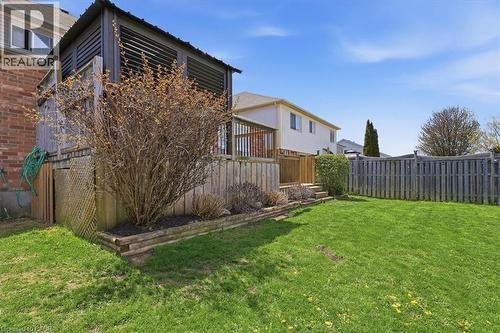 Expansive backyard featuring a manicured lawn and privacy fencing - 136 Carpenter Road, Cambridge, ON - Outdoor With Deck Patio Veranda