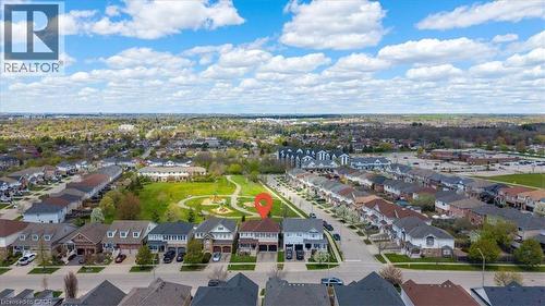 Aerial perspective showcasing a residential neighborhood with detached homes, green spaces, and tree-lined streets - 136 Carpenter Road, Cambridge, ON - Outdoor