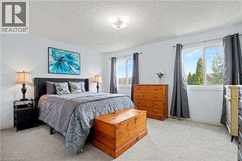 Bright bedroom with light wall paint and recessed ceiling light fixture - 236 Fitzgerald Crescent, Milton, ON - Indoor Photo Showing Bedroom