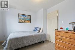 Interior space featuring light-colored walls and carpeted flooring - 