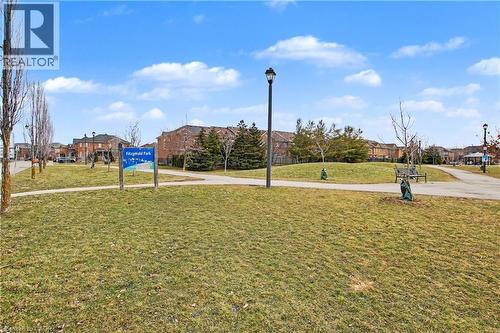 Expansive green space featuring a walking path and mature trees - 236 Fitzgerald Crescent, Milton, ON - Outdoor With View