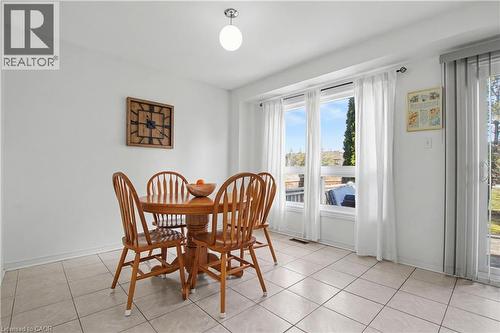 Bright interior space featuring a window wall and sliding glass door - 236 Fitzgerald Crescent, Milton, ON - Indoor Photo Showing Dining Room