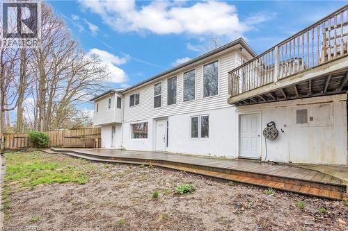 Two-story exterior with white siding and a wood-finish deck - 22 Blackhorne Crescent, Kitchener, ON - Outdoor