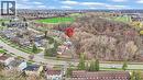 Aerial perspective showcasing a residential neighborhood bordering expansive natural green spaces and mature trees - 22 Blackhorne Crescent, Kitchener, ON  - Outdoor With View 