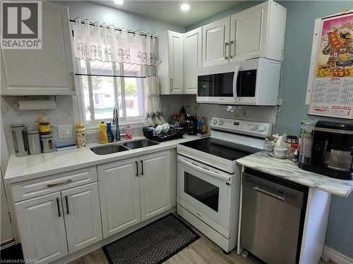 239 West 18Th Street, Hamilton, ON - Indoor Photo Showing Kitchen With Double Sink