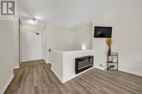 201 - 1000 Cedarglen Gate N, Mississauga, ON - Indoor With Fireplace