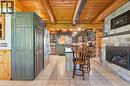 Exposed log beam ceiling - 169 James Street, Atwood, ON  - Indoor With Fireplace 