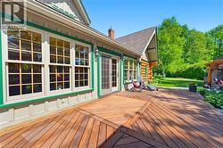 Expansive hardwood deck featuring a geometric inlay pattern - 