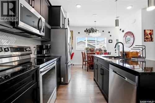 5000 Primrose Green Drive E, Regina, SK - Indoor Photo Showing Kitchen With Double Sink With Upgraded Kitchen