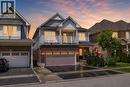 Contemporary two-story residence featuring a brick and siding exterior, an attached two-car garage, and a second-story balcony - 26 Pollard Street, Brantford, ON  - Outdoor With Balcony With Facade 