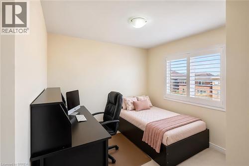 Room featuring a window with white plantation shutters, neutral-toned walls, and a flush-mount ceiling light fixture - 26 Pollard Street, Brantford, ON - Indoor Photo Showing Office