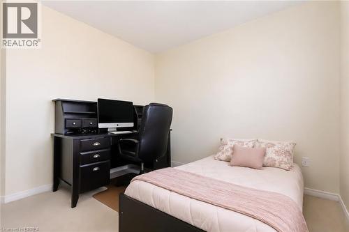 Light-colored wall finishes complement the neutral carpeting - 26 Pollard Street, Brantford, ON - Indoor Photo Showing Bedroom