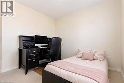 Light-colored wall finishes complement the neutral carpeting - 